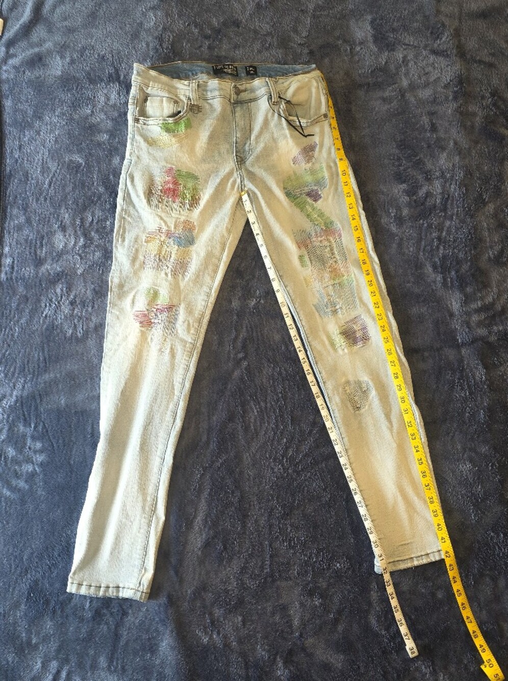 Women’s Light Wash Distressed Skinny Jeans with Multicolor Patch Detail